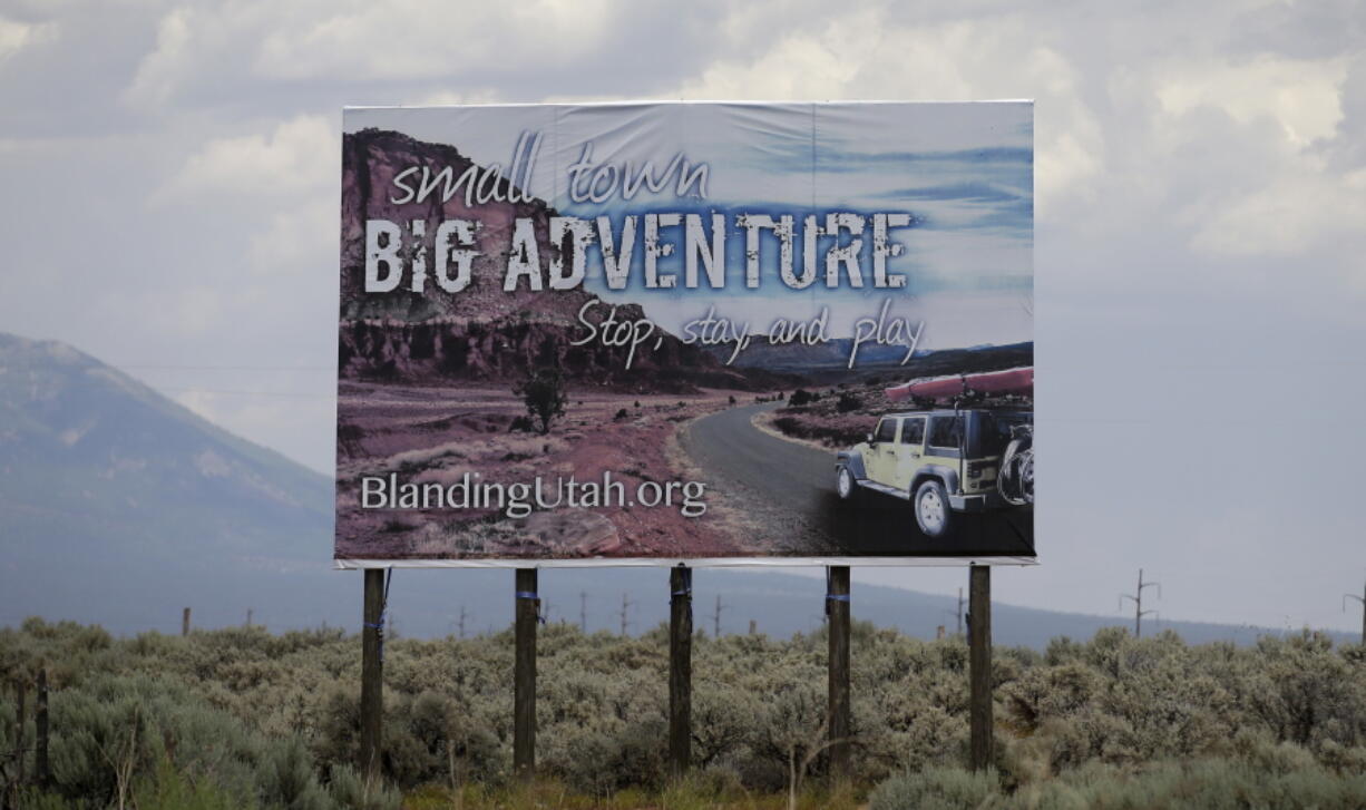 A sign is shown near Blanding, Utah. The rural Utah city, one of the last “dry” communities in the Mormon-majority state, will ask voters Tuesday whether to allow beer and wine sales in town for the first time in more than 80 years.