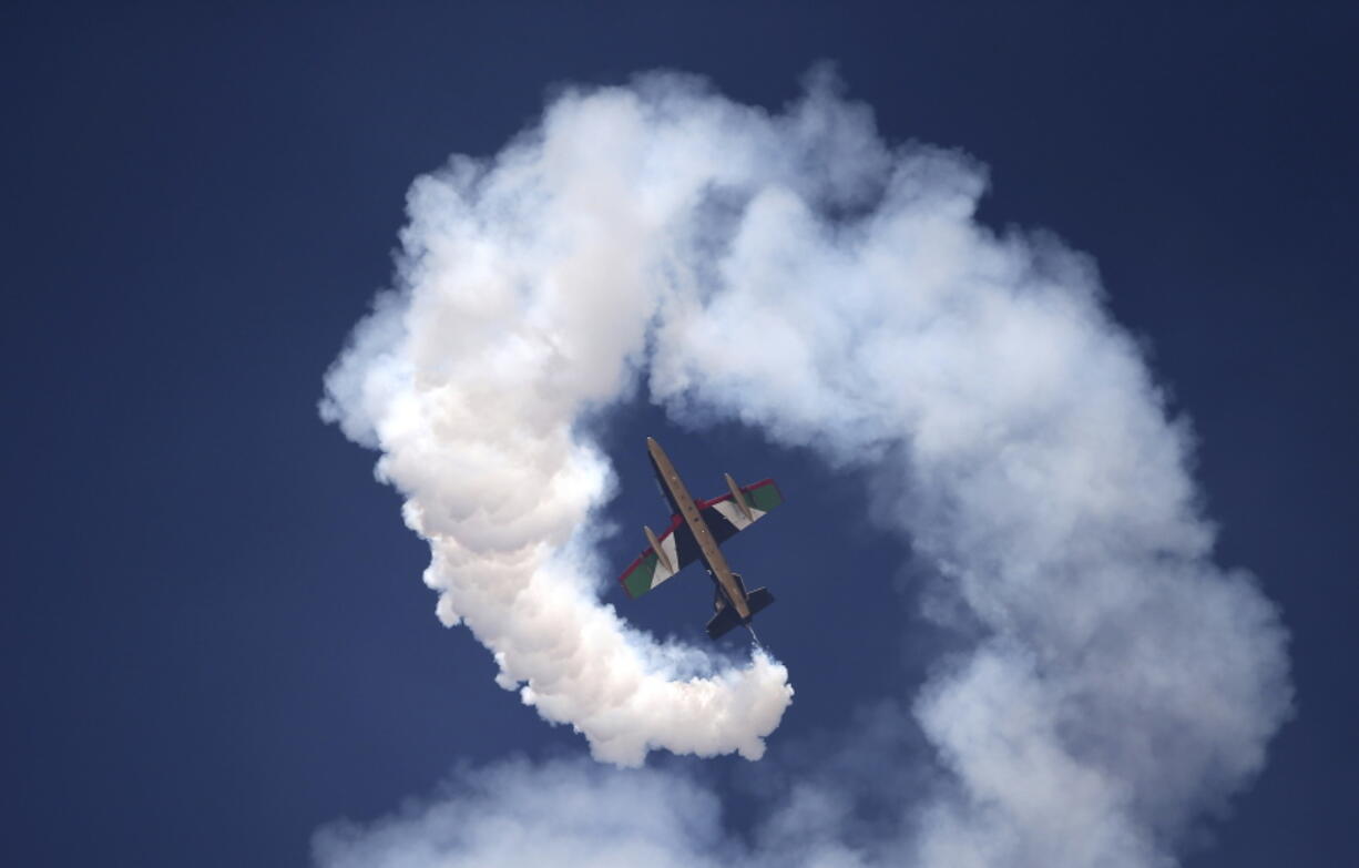 A plane of Al Fursan, or the Knights, a UAE Air Force aerobatic display team, performs during the Dubai Air Show, United Arab Emirates, Monday, Nov. 13, 2017.