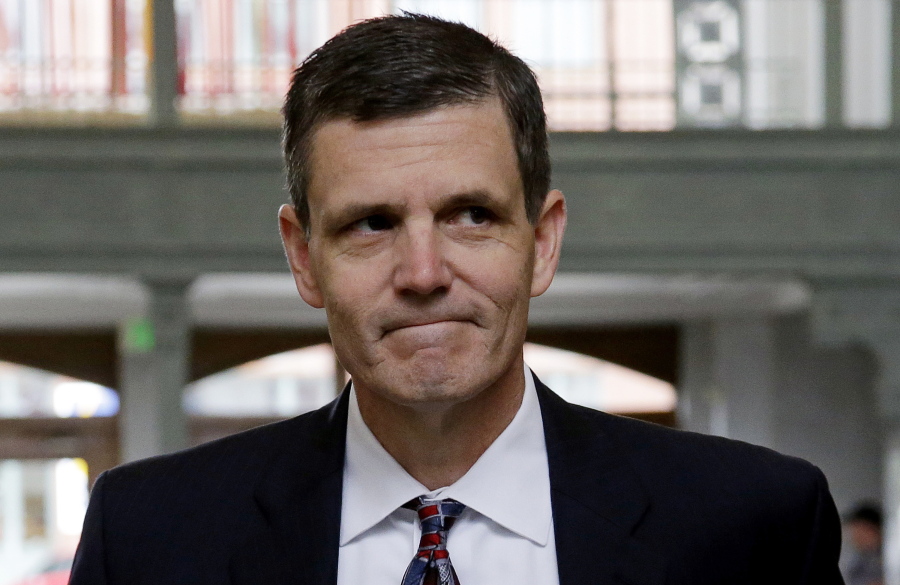 Washington State Auditor Troy Kelley walks into the federal courthouse June 12, 2015 for a hearing on tax evasion charges in Tacoma. Kelley, whose federal fraud trial last year ended with an acquittal on one count and a deadlocked jury on more than a dozen others, will be in a courtroom once again this week as prosecutors try him a second time. And this time, newly recovered emails dating to 2003 could shed light on whether he was entitled to pocket the roughly $3 million the government says he stole when he ran a real-estate services business during the height of last decade’s housing boom.