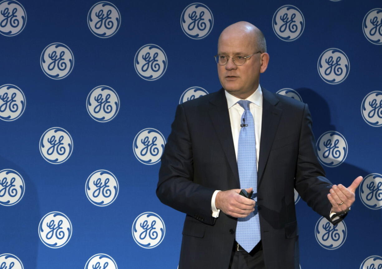 In this Monday, Nov. 13, 2017, photo provided by General Electric, GE Chairman and CEO John Flannery addresses investors at a meeting in New York. Flannery said the company is weighing the future of its transportation, industrial, and lighting businesses so that it can focus more intently on its most profitable divisions.