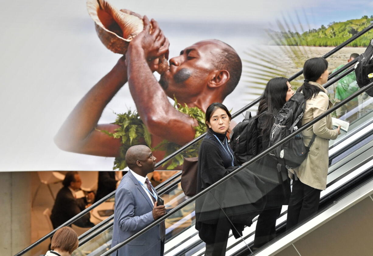 Delegates arrive at the convention center during the COP 23 Fiji UN Climate Change Conference in Bonn, Germany, on Monday.