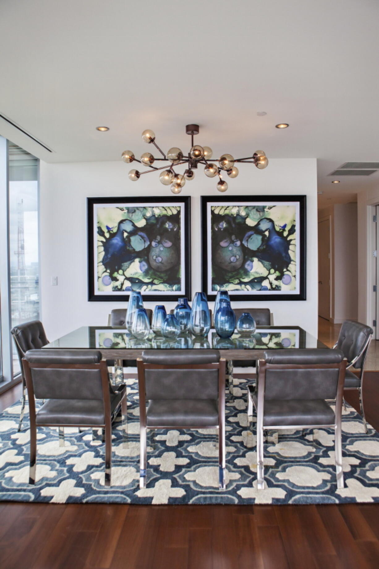 Comfort is just as important as beauty when choosing dining room seating, says Fenimore, founder of the design firm Studio Ten 25, who chose sleek but softly padded chairs for the dining room shown here.