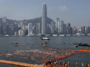 Competitors swim during the annual 1-kilometer harbor race Oct. 29 at the Victoria Harbour in Hong Kong. In a report published Tuesday, market research firm Euromonitor International said it estimates 25.7 million arrivals in Hong Kong this year.