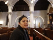 Amanda Morales, 33, poses for a photograph in the sanctuary of the Holyrood Episcopal Church, the Bronx borough of New York. Morales has been living in two small rooms of the gothic church at the northern edge of Manhattan since August, shortly after immigration authorities ordered her deported to her homeland of Guatemala.