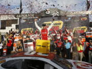 Matt Kenseth celebrates his win in Victory Lane after a NASCAR Cup Series auto race at Phoenix International Raceway Sunday, Nov. 12, 2017, in Avondale, Ariz. (AP Photo/Ross D.