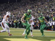 Oregon quarterback Justin Herbert (10), scores a touchdown untouched in the second quarter against Oregon State in an NCAA college football game Saturday, Nov. 25, 2017 in Eugene, Ore.