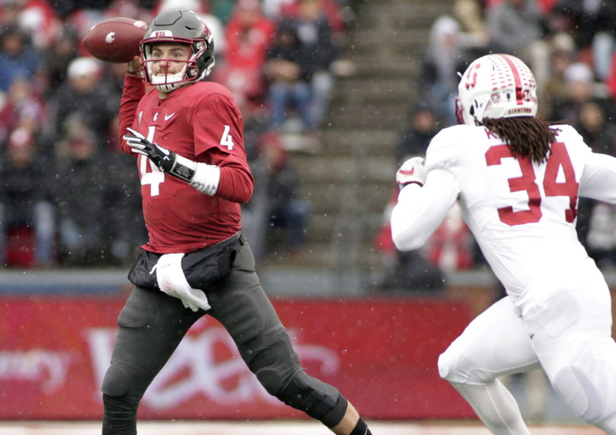 Washington State quarterback Luke Falk (4) throws a pass as he is chased by Stanford linebacker Peter Kalambayi (34) during the first half of an NCAA college football game in Pullman, Wash., Saturday, Nov. 4, 2017.