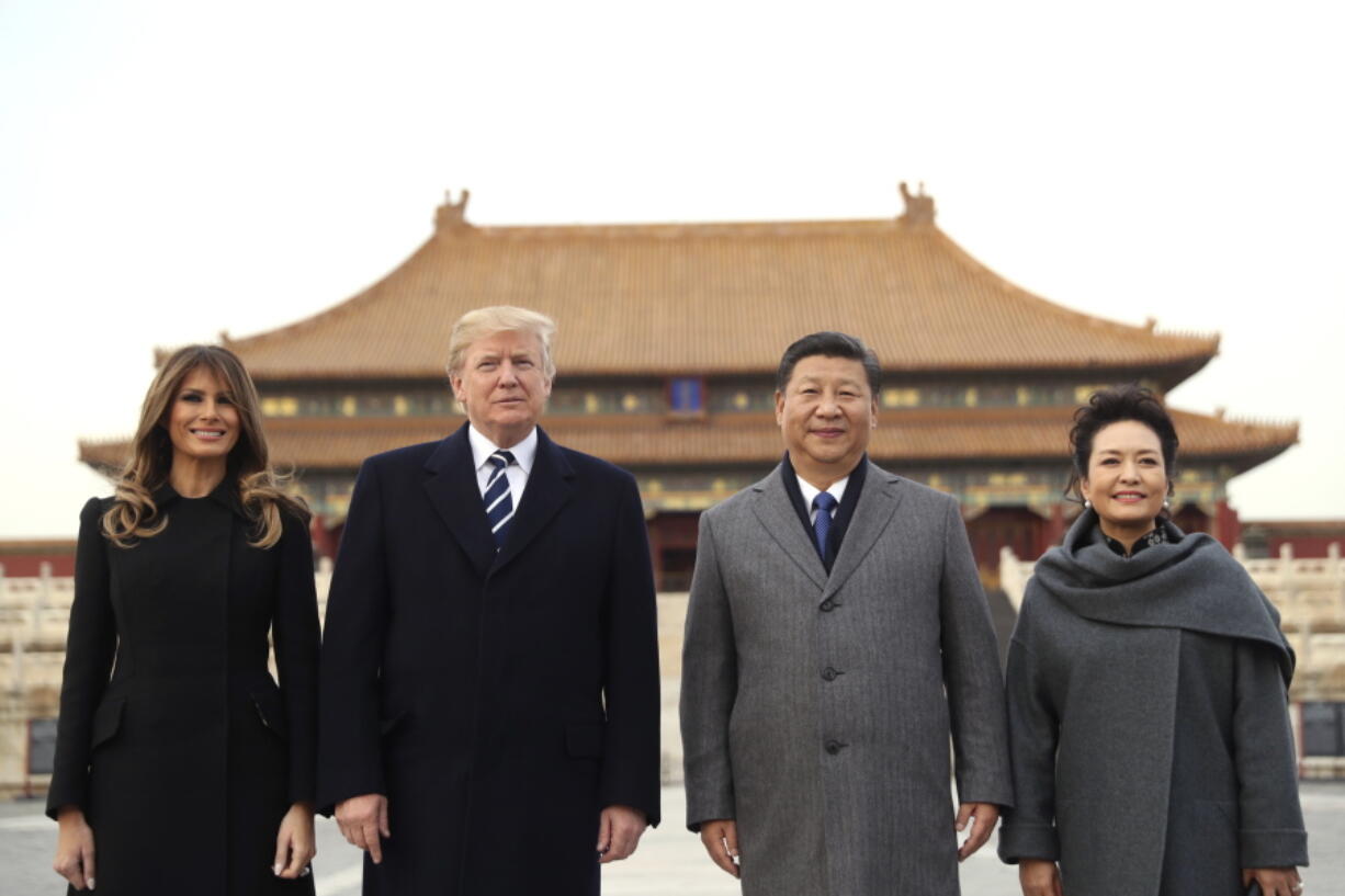 President Donald Trump, second left, first lady Melania Trump, left, Chinese President Xi Jinping, second right, and his wife Peng Liyuan, right, stand together as they tour the Forbidden City on Wednesday in Beijing, China. Trump is on a five country trip through Asia traveling to Japan, South Korea, China, Vietnam and the Philippines.