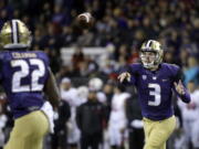 Washington quarterback Jake Browning (3) throws a pass to Lavon Coleman for a 6-yard touchdown against Utah during the first half of an NCAA college football game Saturday, Nov. 18, 2017, in Seattle.