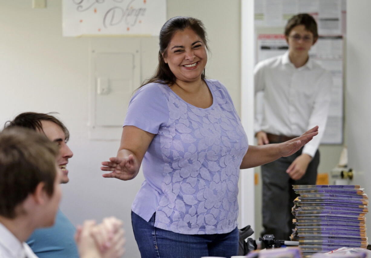 Manka Dhingra, candidate for 45th district Senate seat, talks with volunteers at her campaign headquarters in Redmond, Wash. Voters in the suburbs east of Seattle will determine whether the Washington state Senate will remain the only Republican-led legislative chamber on the West Coast. Democrat Dhingra and Republican Jinyoung Lee Englund are seeking to serve the last year of a four-year term left vacant by the death of Republican Sen. Andy Hill.