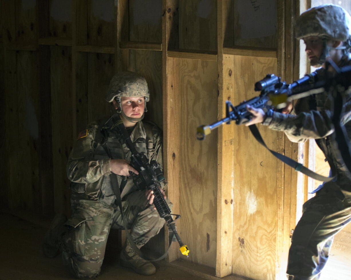 U.S. Army recruit Kirsten practices building clearing tactics with male recruits at Ft. Benning, Ga. She is one of a handful of women training to become infantry soldiers. The Army’s introduction of women into the infantry has moved steadily this year.