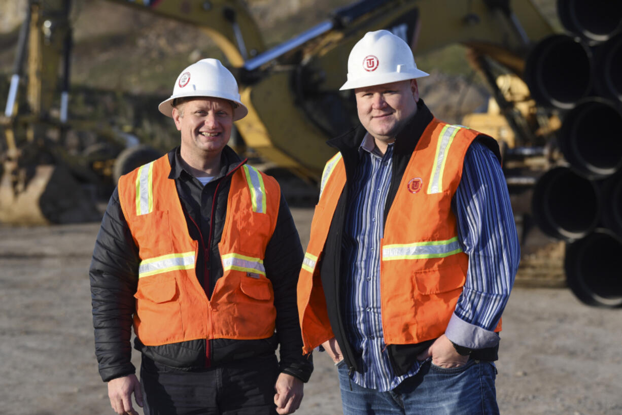 Kevin Tapani, left, and Leigh Tapani are pictured at the construction site for the Columbia Palisades in southeast Vancouver. The brothers are two of six family owners of Tapani Inc., which is coming off a record year for revenue in 2017.