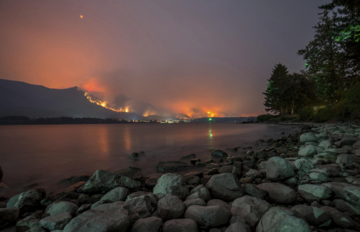 A wildfire burns on Sept. 4 in the Columbia River Gorge above Cascade Locks, Ore., as seen from near Stevenson.