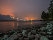 A wildfire burns on Sept. 4 in the Columbia River Gorge above Cascade Locks, Ore., as seen from near Stevenson.