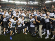 Hockinson celebrates their win against Tumwater after the 2A state football championship game Saturday, Dec. 2, 2017, in Tacoma, Wash.