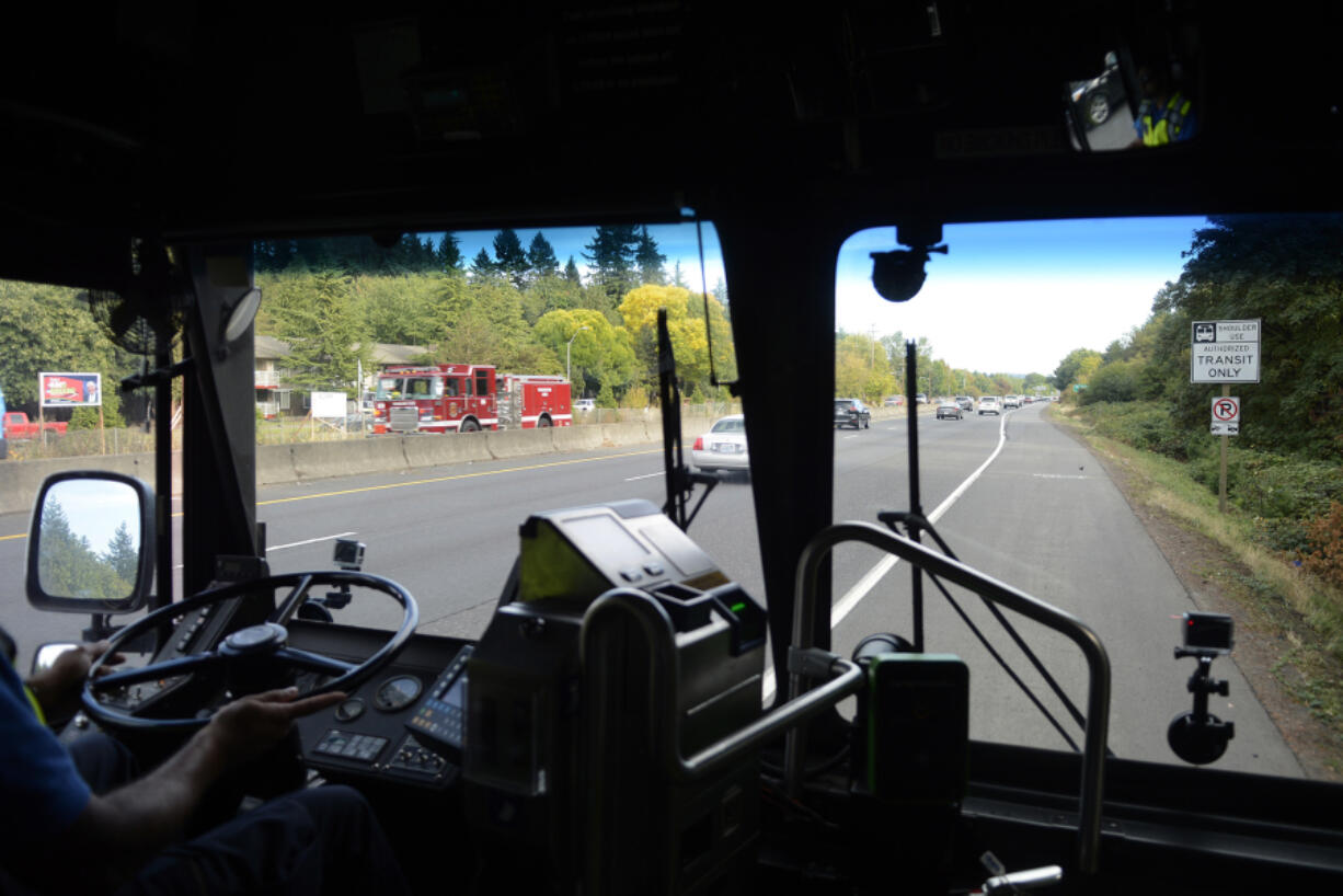 C-Tran operator Vic Nand drives on the shoulder of State Highway 14 on Wednesday afternoon, Oct. 4, 2017.