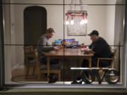 Erica Erland and Mel Buckner work on a puzzle together on Monday evening Nov. 27, 2017, at their home in Vancouver. Mel proposed to Erica singing a Karaoke version of Bruno Mars' "Marry You" in 2012, and a year later they were married on Sept. 1, 2013, in a best friend's backyard in Vancouver.