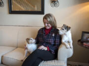 Dawn Horner sits for a portrait in November with her Jack Russell terriers, Mollie and Cooper, at her Vancouver home. Horner was diagnosed with Stage 4 lung cancer in 2014. She has never smoked — though most everyone assumes she must have — and she is now dedicated to educating people about lung cancer.