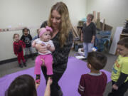 Vancouver resident Alyson Boyse and her daughter, 6-month-old Maya, say goodbye to YWCA Care Children’s Program students after a recent Seeds of Empathy class. The program provides an opportunity for moms with infants to bring their babies in and allow the children a chance to engage with and talk about the baby.