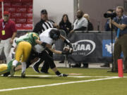 Hockinson's Bailey Jones (26) dives into the end zone for a touchdown with 8 seconds left in half during the 2A state football championship game against Tumwater on Saturday, Dec. 2, 2017, in Tacoma, Wash.