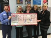 Five Corners: Teach One to Lead One’s Marc Logan, from left, and Tamara Kerr with Silver Star Elementary School, Principal Mari Schauer and iQ for Kids representatives Kari Stansberry and Sherri Smith.