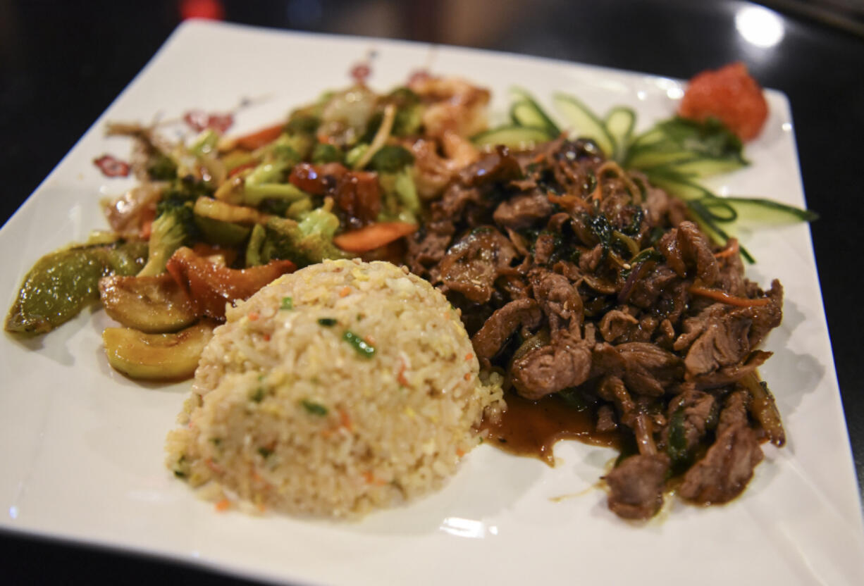 Hibachi sukiyaki steak with fried rice and vegetables at Kyoto Sushi Steakhouse.