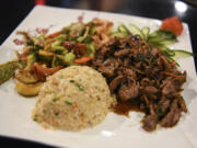 Hibachi sukiyaki steak with fried rice and vegetables at Kyoto Sushi Steakhouse.