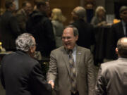 Vancouver City Councilor Jack Burkman speaks with guests during a reception at City Hall.