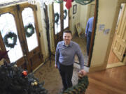 Jordan Boldt, director of the Vancouver Farmers Market, is pictured in the entryway of the Slocum House in downtown Vancouver.