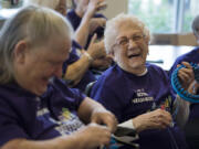 Judy Smith, left, and Marge Kleen, both of Vancouver, share a laugh as they work on their knitting projects during their weekly Knitty Gritty Heroes meet up at Vista Court, an income-restricted senior apartment complex in downtown Vancouver. The women have made more than 500 hats and 13 fleece blankets for local people experiencing homelessness.