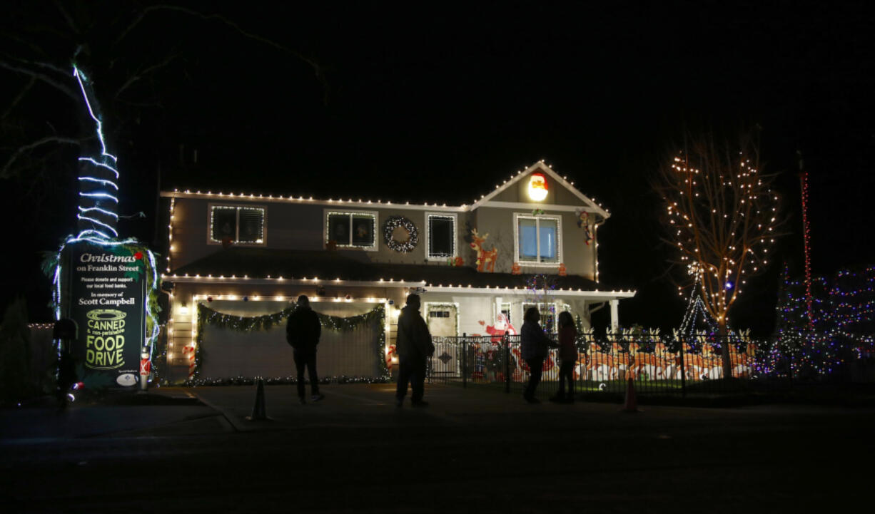 The Christmas light display on Northwest Franklin Street in Vancouver includes a food drive in honor of the late civic leader Scott Campbell.