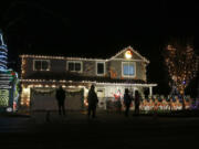 The Christmas light display on Northwest Franklin Street in Vancouver includes a food drive in honor of the late civic leader Scott Campbell.