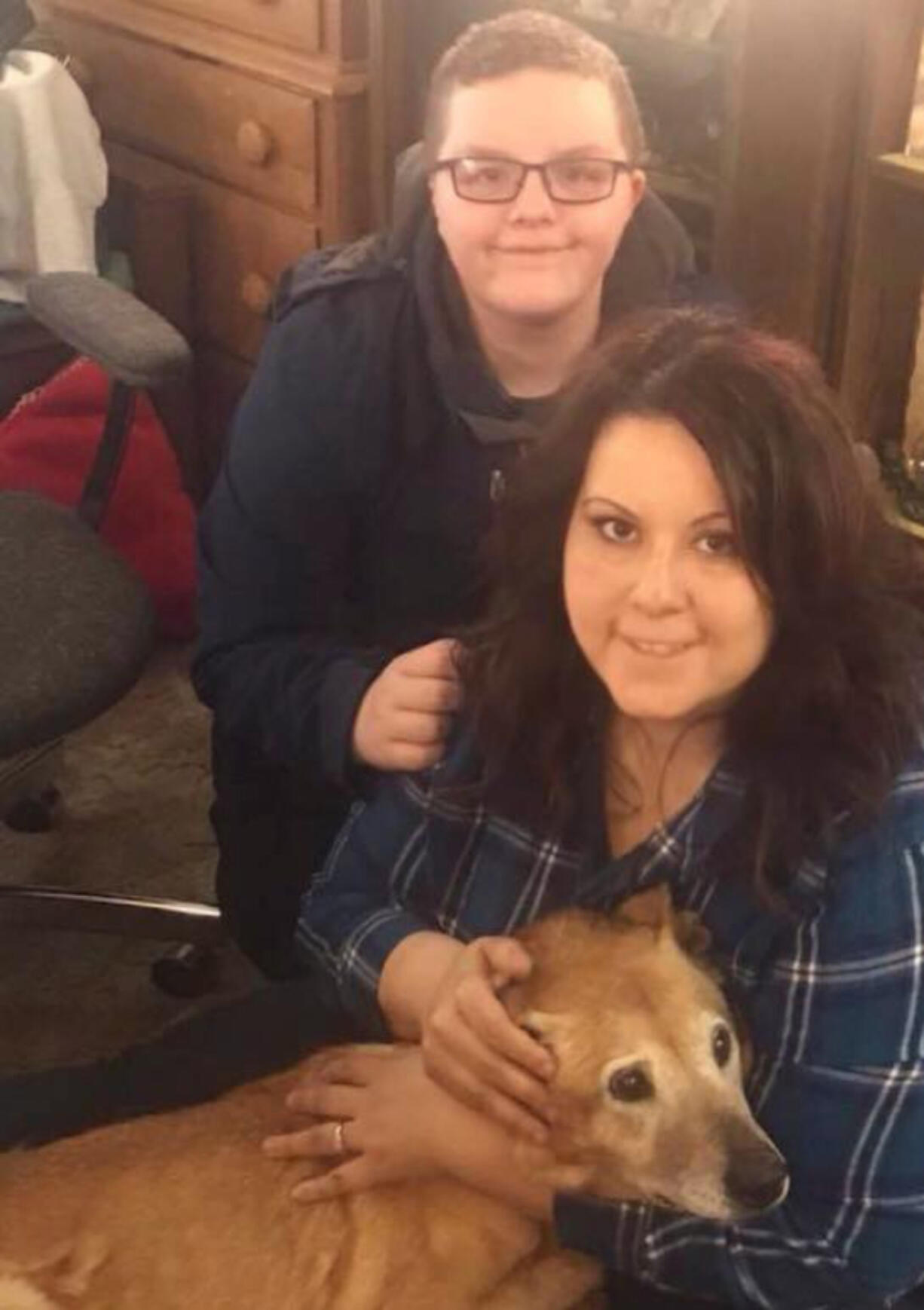 Tomisa Bates and her son, Jaxson, with their dog, Deacon. When Deacon died this year, Bates’ Facebook group organized a fundraiser.