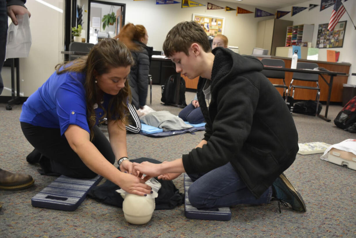 Washougal: Michelle Kruse of Emergency Response Consultants, left, and Washougal High School student Josh Veselka during a course on CPR and first aid.