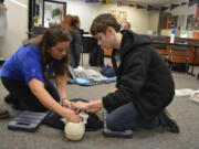 Washougal: Michelle Kruse of Emergency Response Consultants, left, and Washougal High School student Josh Veselka during a course on CPR and first aid.