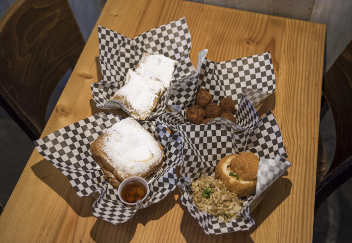 A Monte Cristo sandwich, clockwise from left, Beignets, Boudin Balls and Shrimp Pistolette are among the offerings at La Oie Cajun Cuisine, which is parked outside of Brothers Cascadia Brewing.