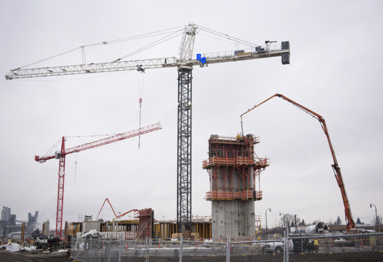 Construction continues Friday morning on Block 6 at The Waterfront Vancouver. A seven-story office building and six-story apartment building are expected to be structurally complete by September.