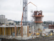Construction continues on Block 6 at The Waterfront Vancouver on Friday morning. Gramor Development, the Tualatin, Ore.-based firm overseeing the redevelopment, said two buildings on the block could be completed by September.