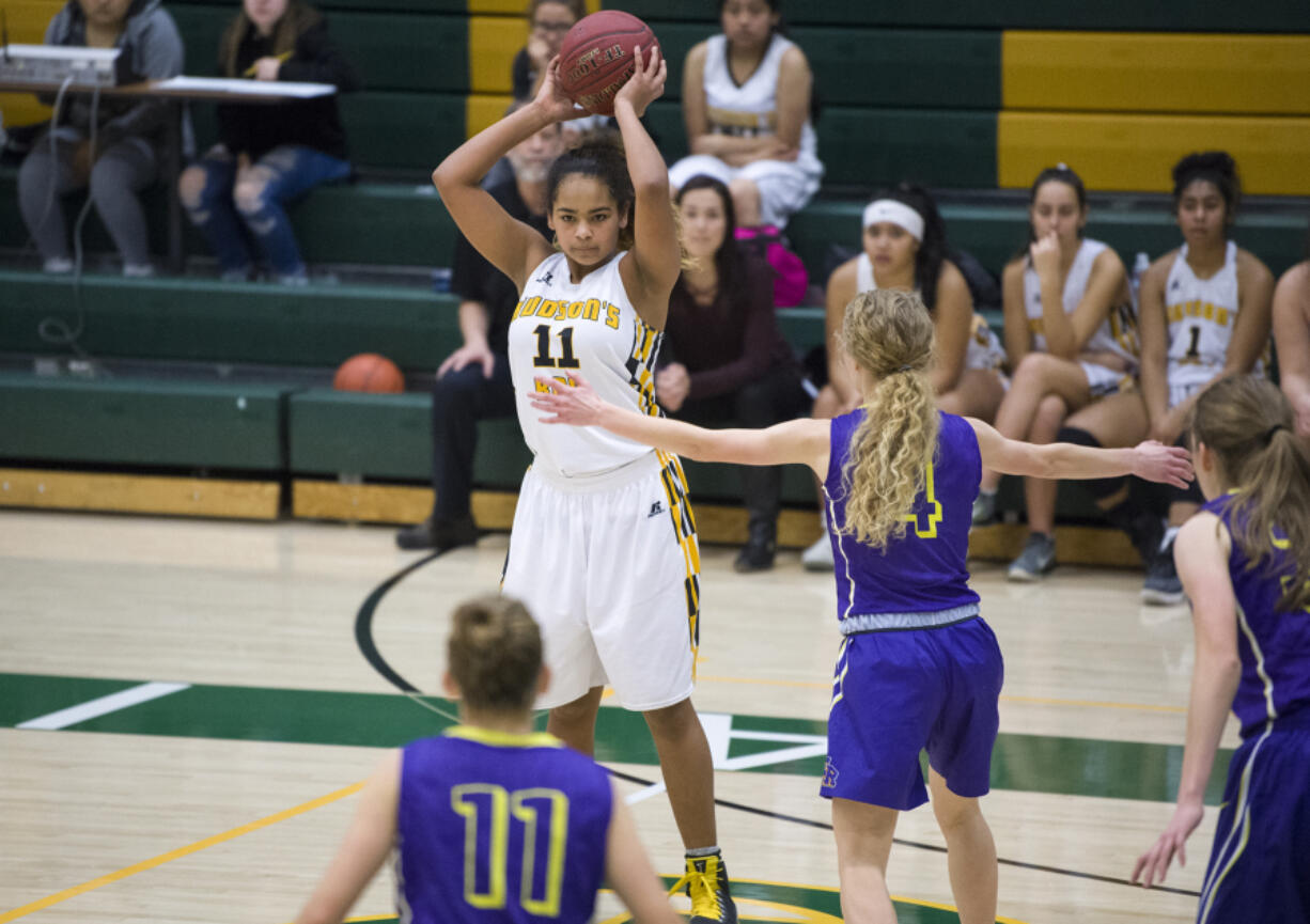 Hudson’s Bay’s Jaydia Martin (11) prepares to make a pass to a teammate during the Hoops for the Holidays.