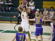 Hudson’s Bay’s Jaydia Martin (11) prepares to make a pass to a teammate during the Hoops for the Holidays.