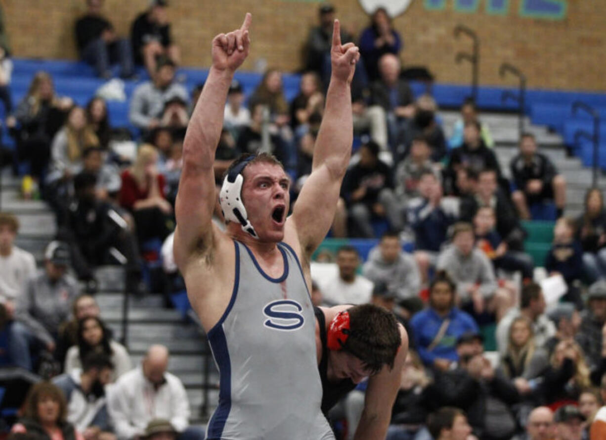 Jackson McKinney of Skyview, reacts to defeating Sam Malychewski of Camas in the 195 pound championship match.