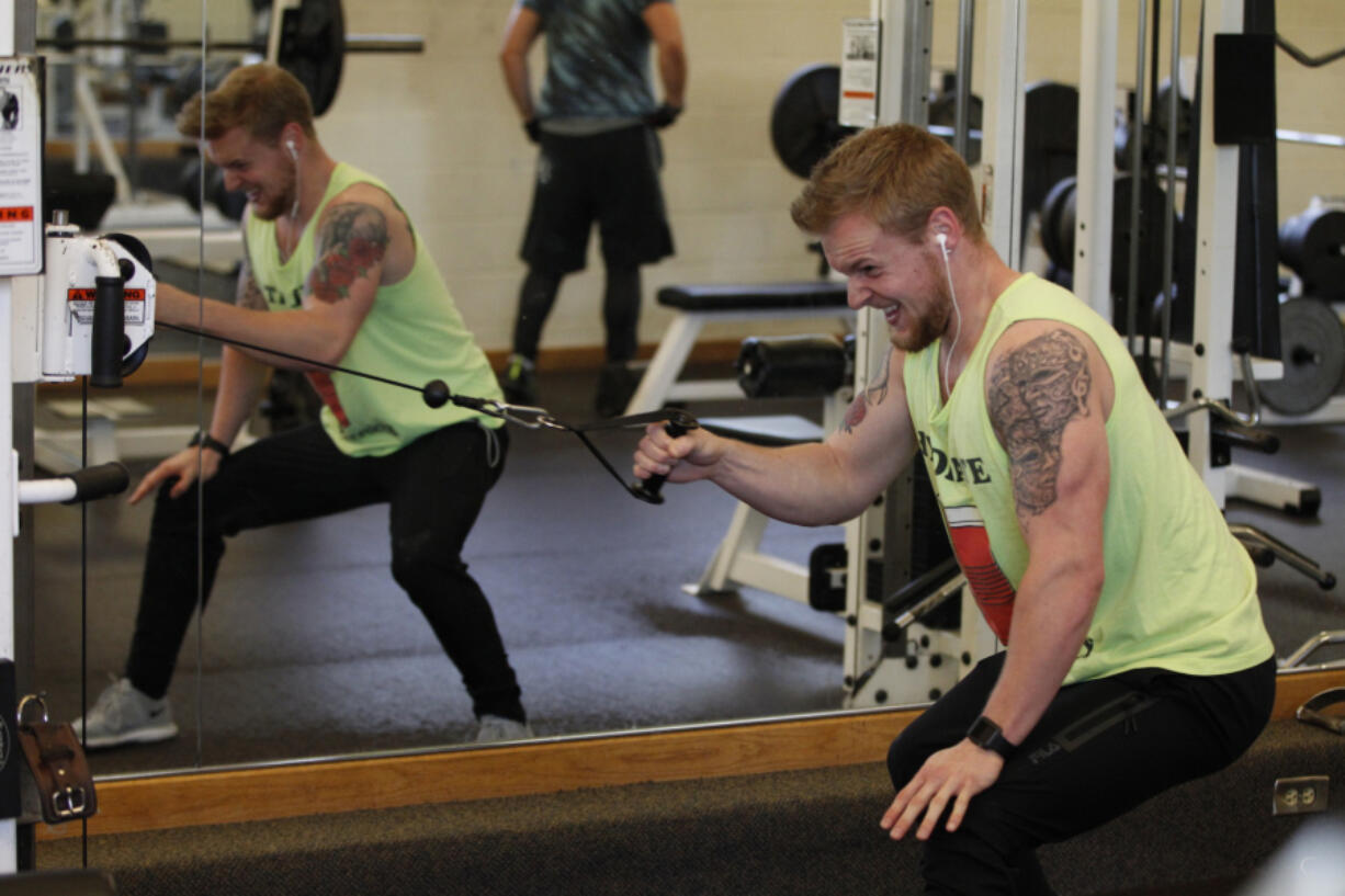 Keaton Wilbanks works out at Lake Shore Athletic Club Sunday afternoon. It’s good to see a glut of new faces at the club come the new year, he said.