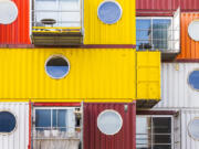 Modular homes built out of shipping containers, like these in England, are one of the possibilities for affordable housing. But, developers say, the zoning restrictions inhibit the cost savings.