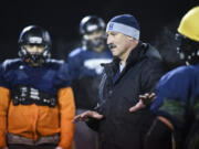 Hockinson Head Coach Rick Steele explains a strategy to Hockinson players during practice at Battle Ground District Stadium on Tuesday.