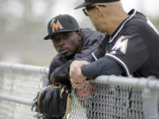 The Miami Marlins traded second baseman Dee Gordon, left, to the Seattle Mariners on Thursday for three prospects and international slot money.