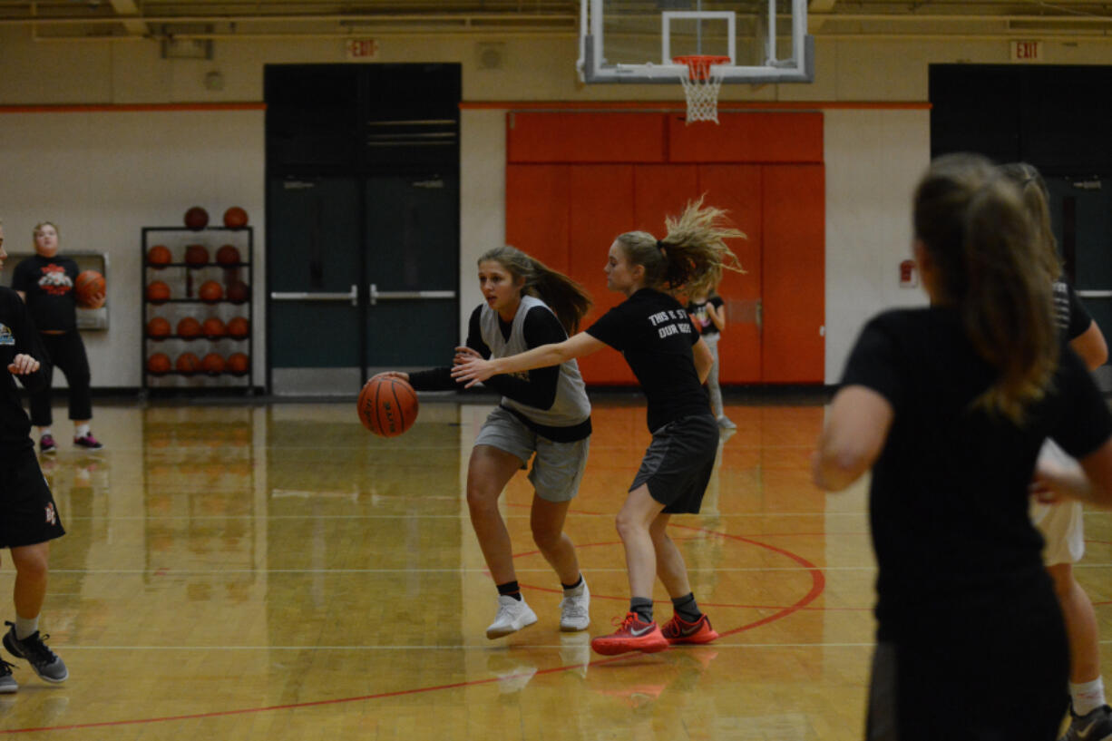 Morgan Stradley, left, is a four-year varsity player who led Battle Ground in scoring last season.