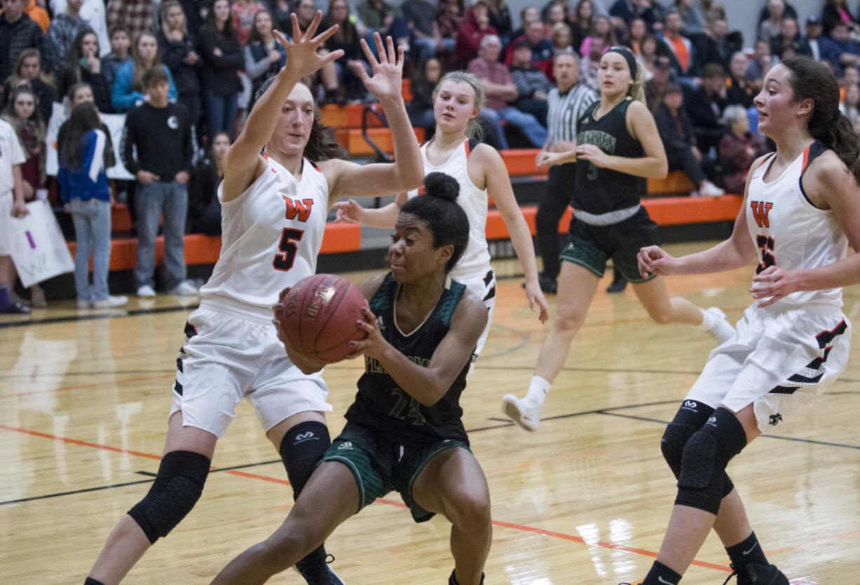 Evergreen’s Ahna Burney, here facing Washougal, scored a season-high 35 points Dec. 5 against Union.