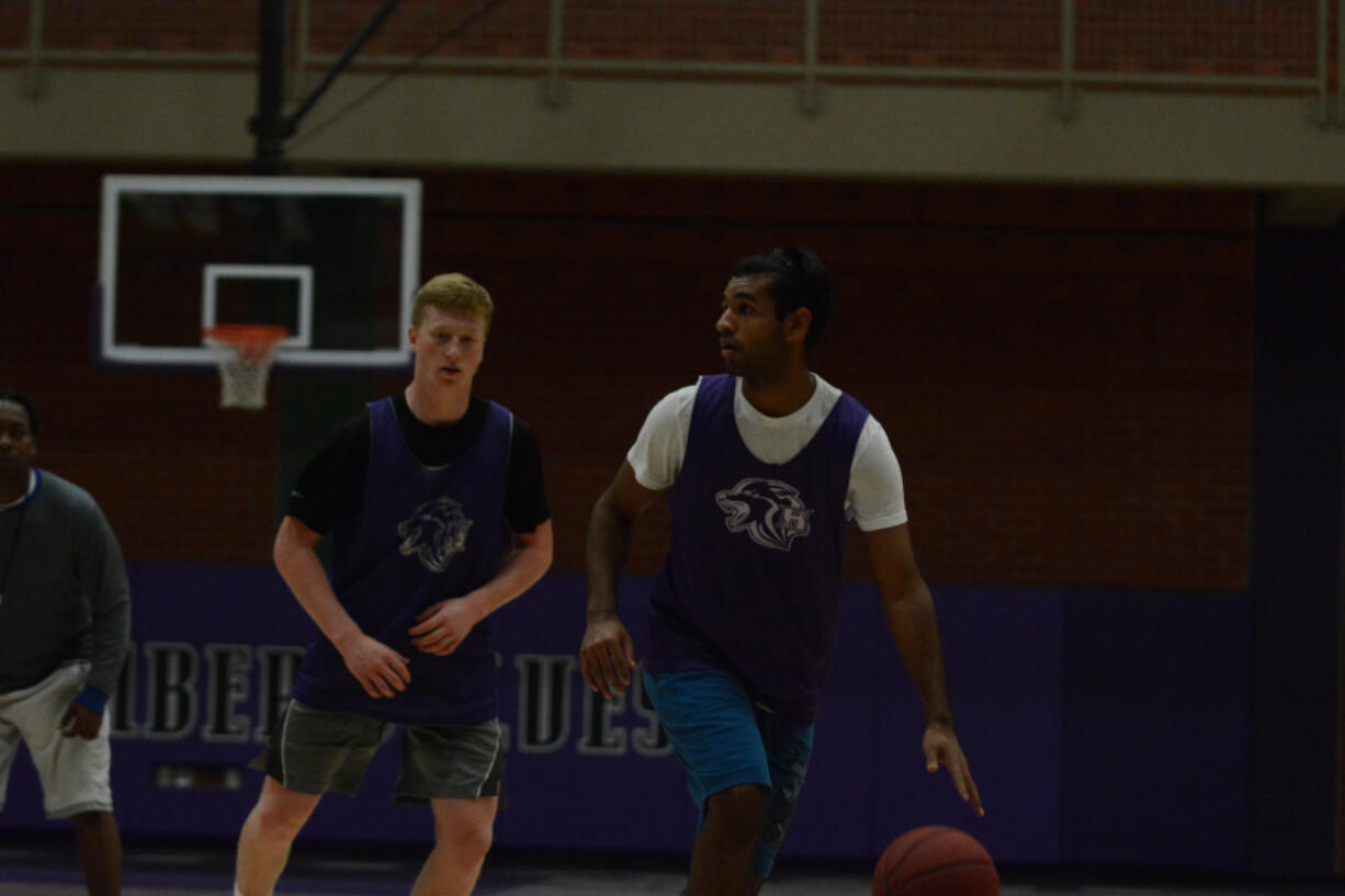 Sanjeet Singh, right, leads a four-guard lineup at Heritage.