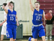 La Center guard, Avery Seter (12), celebrates as time runs out against Newport during the WIAA 1A boys state tournament finals, on Saturday, Mar. 4, 2017 at the Yakima Valley SunDome. La Center defeated Newport 51-38, winning fourth place.