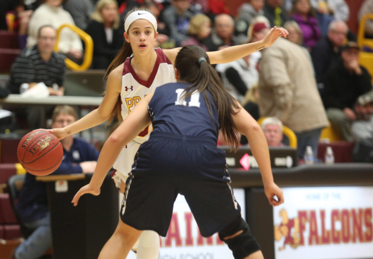 Cassidy Gardner of Prairie tries to navigate around Skyview's Remington Riley at a basketball game in Vancouver Tuesday December 13, 2016.